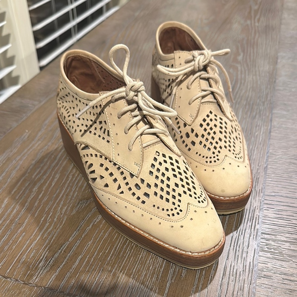 Cream Oxfords with Wingtip Design and Intricate Perforations